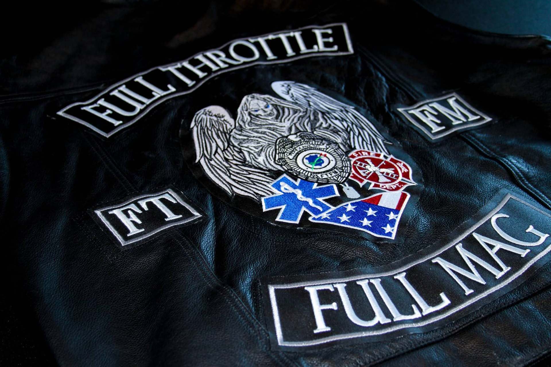 Cinematic close-up of the FTFM center patch on leather