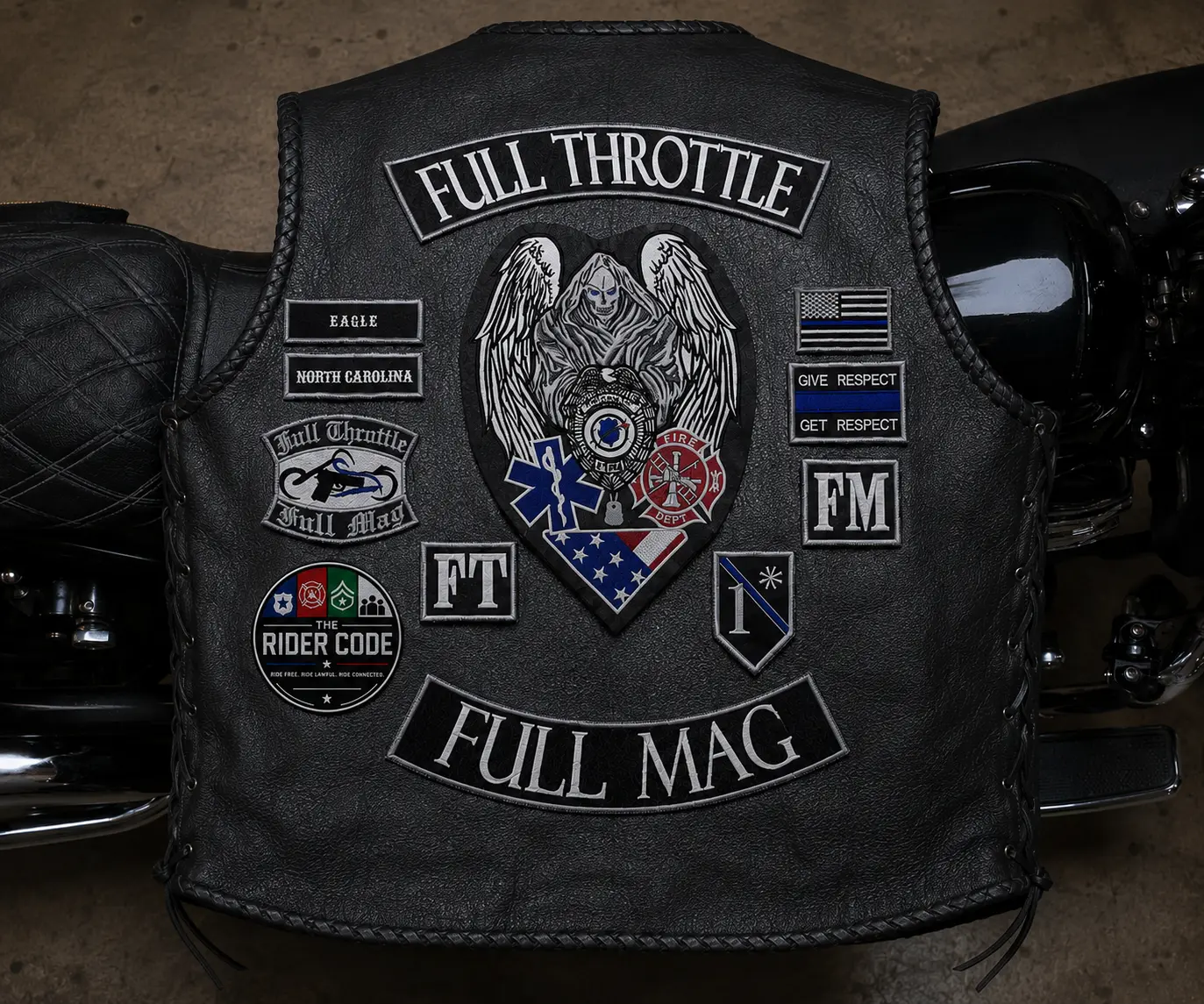 The back of an FTFM leather vest featuring the Eagle and North Carolina chapter patches, FULL THROTTLE and FULL MAG rockers, and The Rider Code emblem.